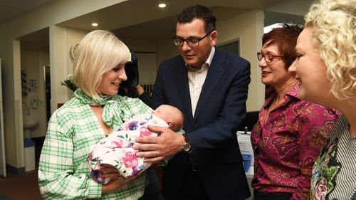 The Andrews team with the first official baby cuddle of the campaign.