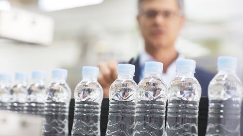 An investigation led by a US-based media company and university has found major bottled water brands contain plastic particles (Getty).