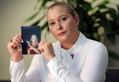 Virginia Roberts holds a photo of herself at age 16, when she says Palm Beach multimillionaire Jeffrey Epstein began abusing her sexually. (Emily Michot/Miami Herald/TNS/Sipa USA) .