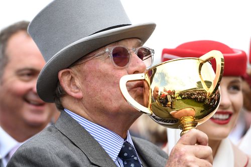 Almandin's owner Lloyd Williams kisses the Melbourne Cup after last year's victory. (AAP)