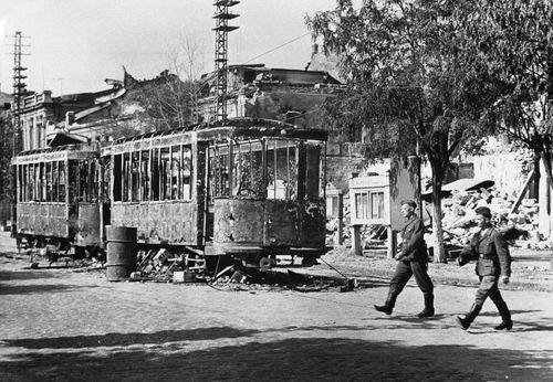Nazi soldiers are seen here crossing a street in Vernolejinsk in the Southern Ukraine on Sept. 3, 1941 after the Russians had evacuated it. Note the burnt-out street cars in the centre of the road fired by the Russians in accordance with their 'Scorched Earth' policy before they left. (AP Photo)