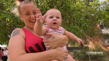 Sydney baby thrown from window to escape burning building