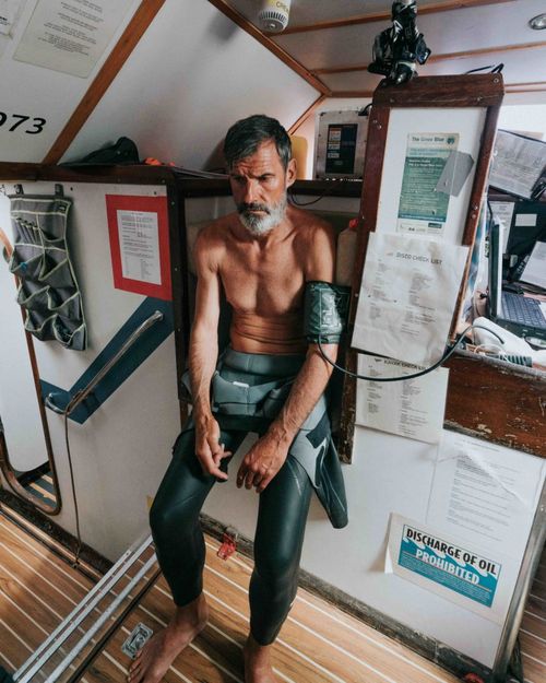 Crew monitor Ben Lecomte, on a day when he was struggling with sickness. Lecomte still swam for more than seven hours that day, before collapsing into his bed, exhausted and weak.