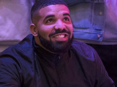 Drake watches a screen alongside other Toronto Raptors fans as they gather to watch Game Six of the NBA Finals.