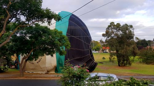 Man wakes up to the sound of a hot-air balloon landing in a park opposite his Melbourne home
