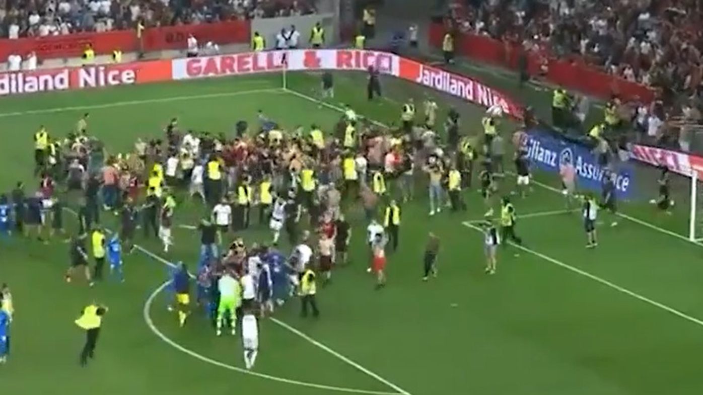 Wild brawl between players and fans halts match