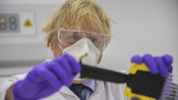 Britain&#x27;s Prime Minister Boris Johnson visits the French biotechnology laboratory Valneva in Livingston, Scotland, Thursday Jan. 28, 2021, where they will be producing a COVID-19 vaccine on a large scale, during a visit to Scotland.