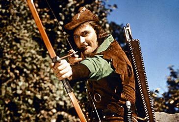 When did Errol Flynn play the titular role in The Adventures of Robin Hood?