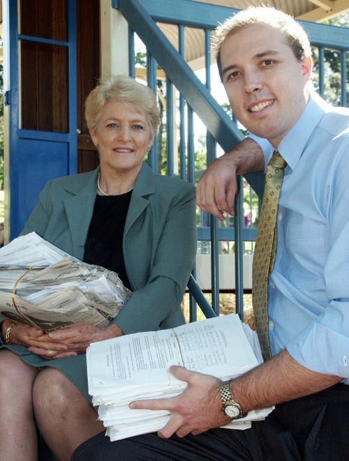 Faye Kennedy (left) and Liberal MP Peter Dutton, pictured in 2003, with 18,000 signed petitions for the modernisation of the 800-year-old double jeopardy laws. The law was reformed in 2007 and again in 2014. Picture: AAP