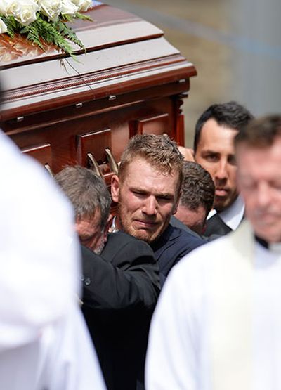 Aaron Finch was unable to contain his emotions as he carried the coffin.