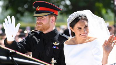 Prince Harry, Duke of Sussex and Meghan, Duchess of Sussex leave Windsor Castle in the Ascot Landau carriage during a procession after getting married at St Georges Chapel on May 19, 2018 in Windsor, England.