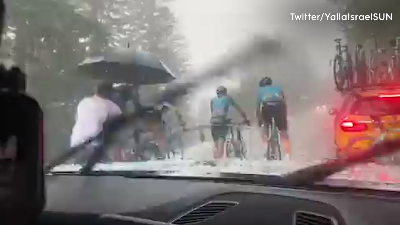 Chaos unfolds as professional cyclists pelted with hail in France
