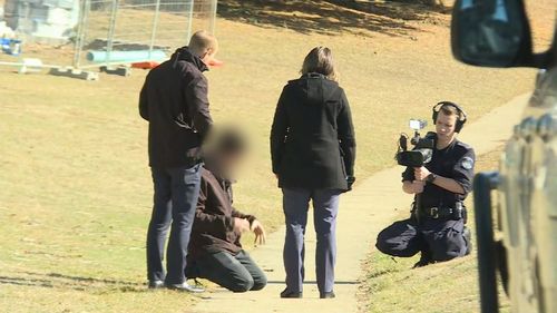 A man and his friend were assaulted by a group of three men in Jindabyne.