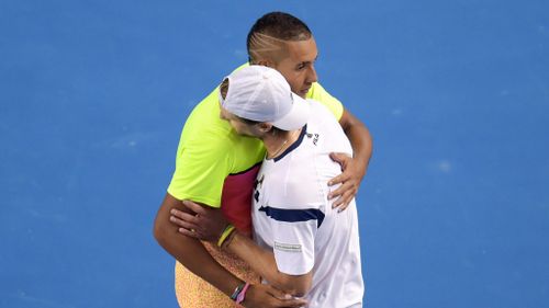 Nick Kyrgios hugs Andreas Seppi of Italy after winning their fourth round match at the Australian Open. (AAP)
