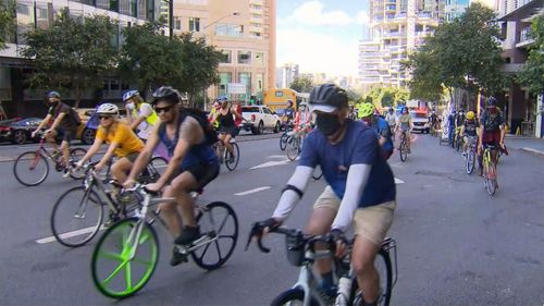 Protesters from the climate action group Extinction Rebellion are holding a slow cycle in Brisbane this morning.