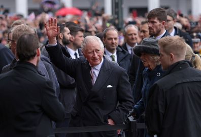 King Charles III waves to the crowd as he and Camilla, Queen Consort, arrive at Hamburg City Hall on March 31, 2023 in Hamburg, Germany. 
