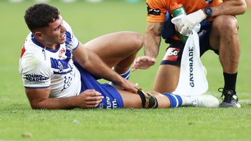 Jake Averillo of the Bulldogs receives treatment after sustaining an injury during the round seven NRL match between Parramatta Eels and Canterbury Bulldogs at CommBank Stadium on April 16, 2023 in Sydney, Australia. (Photo by Matt King/Getty Images)