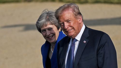 US President Donald Trump (pictured with UK Prime Minister Theresa May) has said at a NATO summit in Brussels, Belgium, that European allies must lift their defence spending. (AAP)