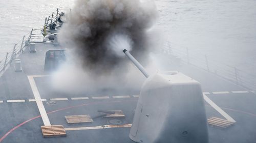the Arleigh Burke-class guided-missile destroyer USS Stethem (DDG 63)as it conducts a firing exercise of the MK 45/5-inch lightweight gun at a surface target (AFP).
