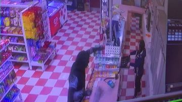 Masked man storms deli armed with knife and pole