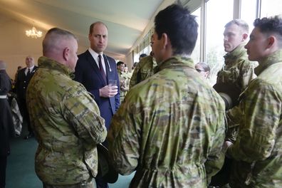 Prince William talks to troops from the 5th Royal Australian Regiment (5RAR) after a St David's Day parade with members of the 1st Battalion, The Welsh Guards in Windsor England, Wednesday, March 1, 2023 
