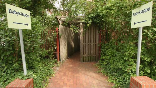 Behind these gates at a hospital in Germany is a baby hatch where women can leave their unwanted newborns. (Getty)