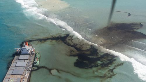This photo provided by the French Army shows oil leaking from the MV Wakashio, a bulk carrier ship that ran aground off the southeast coast of Mauritius, Tuesday Aug.11, 2020.