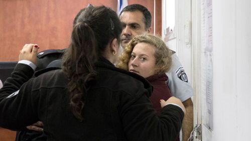  Palestinian Ahed Tamimi Is escorted at a military court near Jerusalem