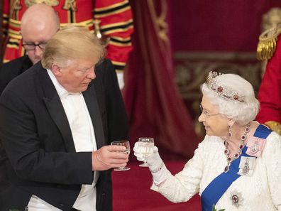 US President Donald Trump, left and Queen Elizabeth II toast, during the State Banquet at Buckingham Palace, in London, Monday, June 3, 2019. 