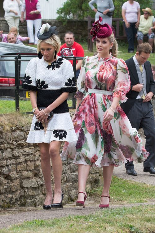 Lady Kitty among the guests at the wedding, looking lovely in floaty floral. Picture: Splash. 