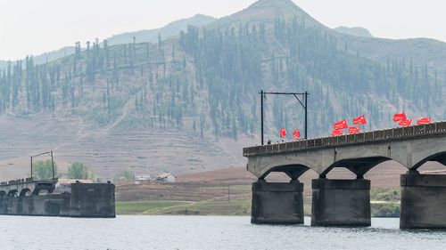 A bridge on the border between Chinese and North Korea, bombed during the Korean War but never repaired.
