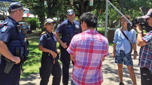 Ms Berry and colleagues participating in segment for Japanese TV. (Queensland Police Service)