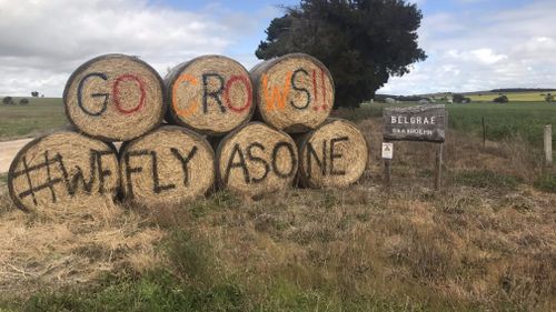 Local businesses have lined the roads with cheers for Adelaide.