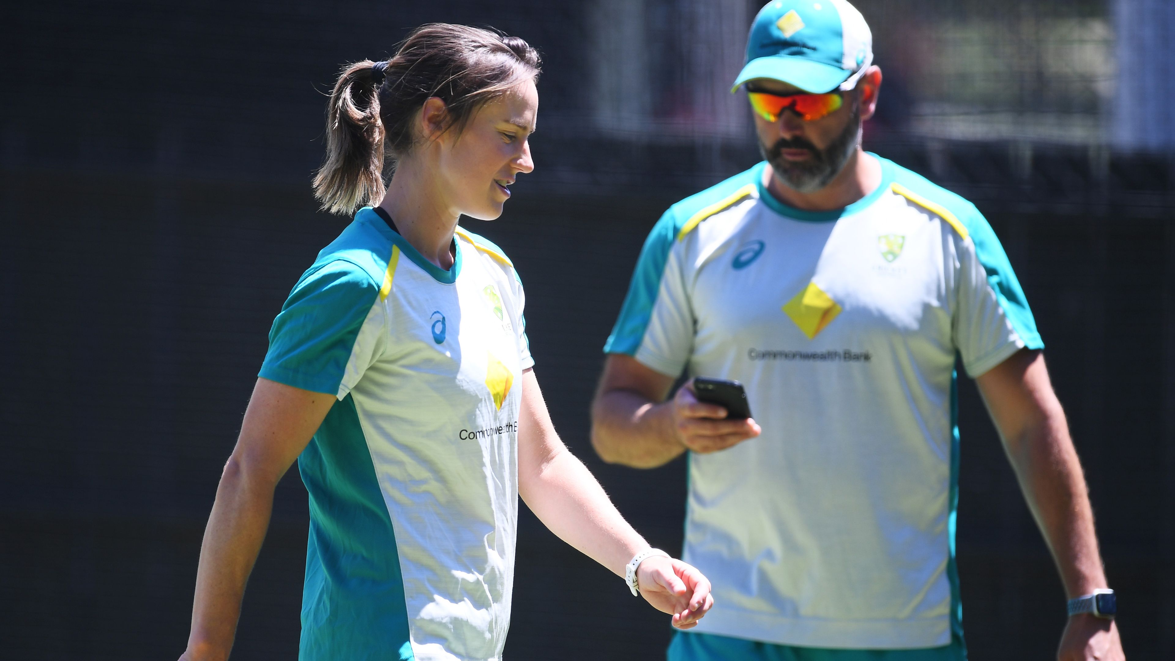 Ellyse Perry of Australia works on her bowling with bowling coach Ben Sawyer.
