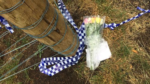 Flowers were laid for the woman at the scene. (Madeline Slattery)