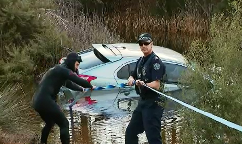 Police spent the afternoon retrieving the submerged Lancer and collecting it as evidence.