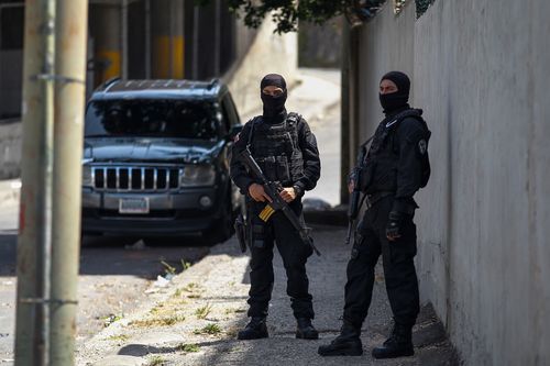 Security agents guard the headquarters of the Bolivarian Intelligence Service (Sebin) also known as Helicoide, as inmates at the crowded detention centre at Helicoide rioted and took control over the facility. Picture: EPA/Helena Carpio