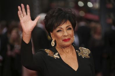 Dame Shirley Bassey poses for photographers upon arrival at the Olivier Awards