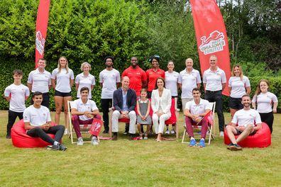 Prince William, Duke of Cambridge, Princess Charlotte of Cambridge and Catherine, Duchess of Cambridge pose for a group photograph during a visit to SportsAid House at the 2022 Commonwealth Games on August 02, 2022 in Birmingham, England.