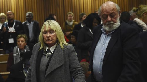 FILE  The parents of the late Reeve Steenkamp, June, left, and Barry Steenkamp, right, leave the High Court in Pretoria, South Africa, Wednesday, July 6, 2016. Eight years after he shot dead his girlfriend, Pistorius is up for parole, but first he must meet with her parents, June and Barry Steenkamp, as part of the parole procedure..(Masi Losi, Pool Photo via AP)
