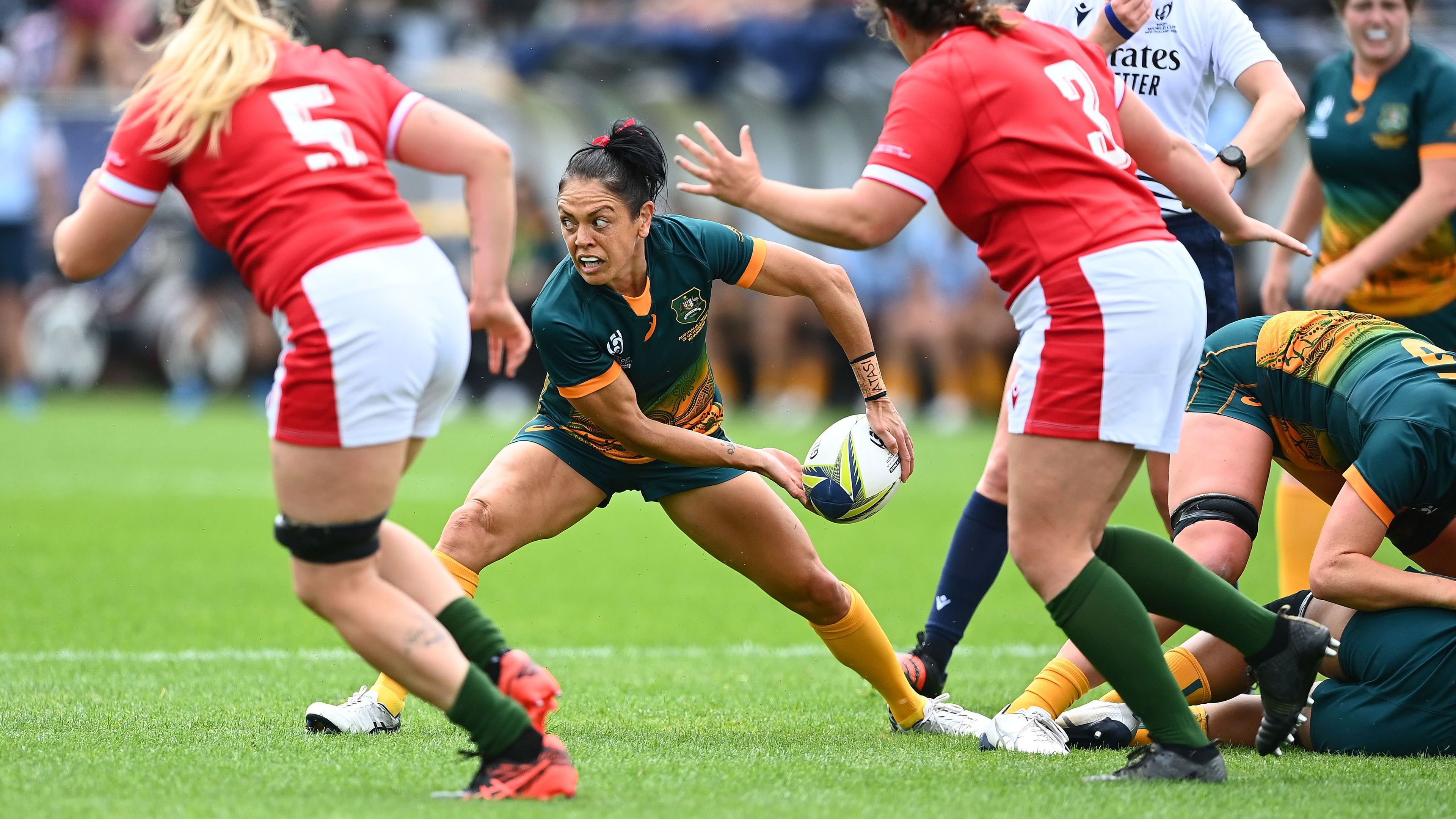 Iliseva Batibasaga of Australia passes during the Pool A Rugby World Cup 2021 match between Australia and Wales