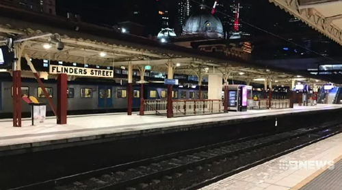 Melbourne’s train network was brought to a standstill after a hooded trespasser jumped onto the tracks at Flinders Street Station.
