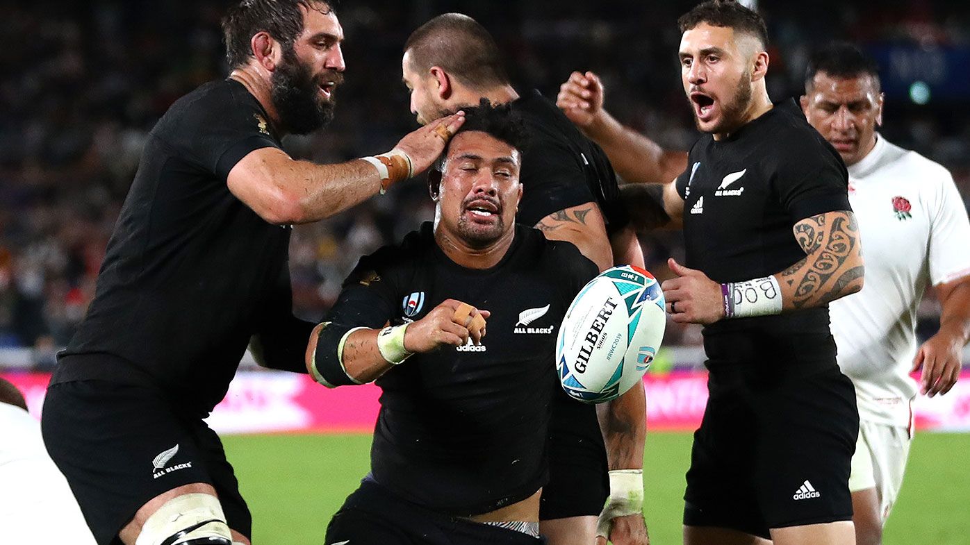 Ardie Savea of New Zealand celebrates scoring his teams first try with teammates Samuel Whitelock and TJ Perenara of New Zealand during the Rugby World Cup 2019 