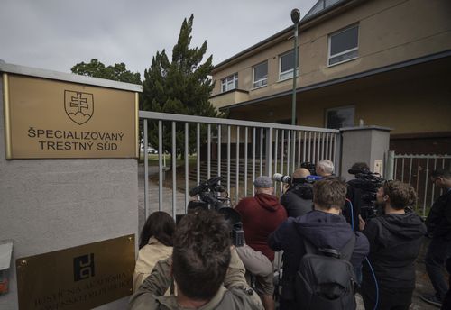 Journalists gather as they wait for the suspect, in shooting of Slovakia's Prime Minister Robert Fico, to be brought to court in Pezinok, Slovakia, Saturday, May 18, 2024.