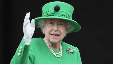 Queen Elizabeth II waves to the crowd during the Platinum Jubilee Pageant at the Buckingham Palace in London, Sunday, June 5, 2022, on the last of four days of celebrations to mark the Platinum Jubilee. 