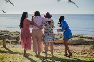 Happy group of women, friends, smiling outside