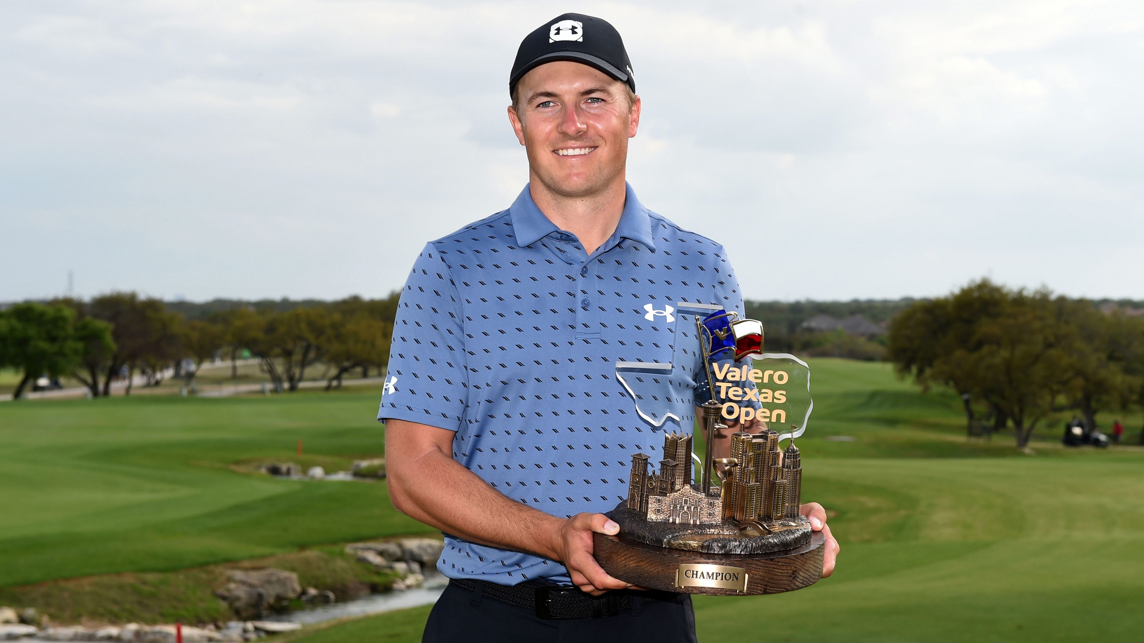 Jordan Spieth poses with the trophy after winning the Texas Open.