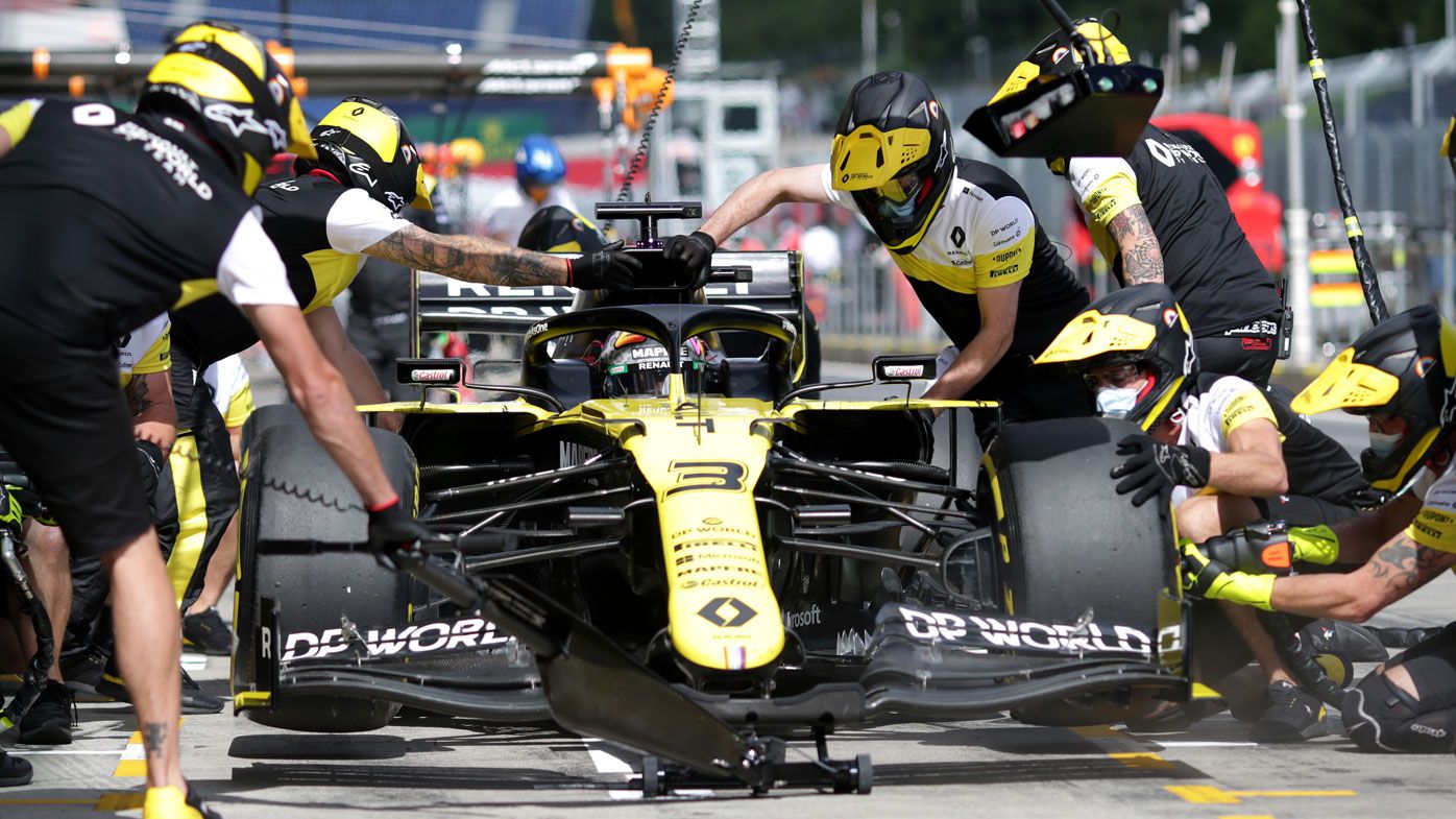 Daniel Ricciardo of Australia and Renault Sport F1 comes in for a tyre change