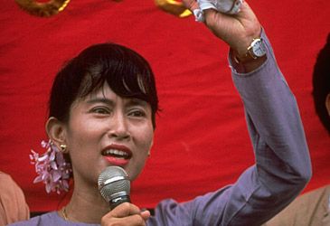 When was Aung San Suu Kyi first placed under house arrest by the military junta?