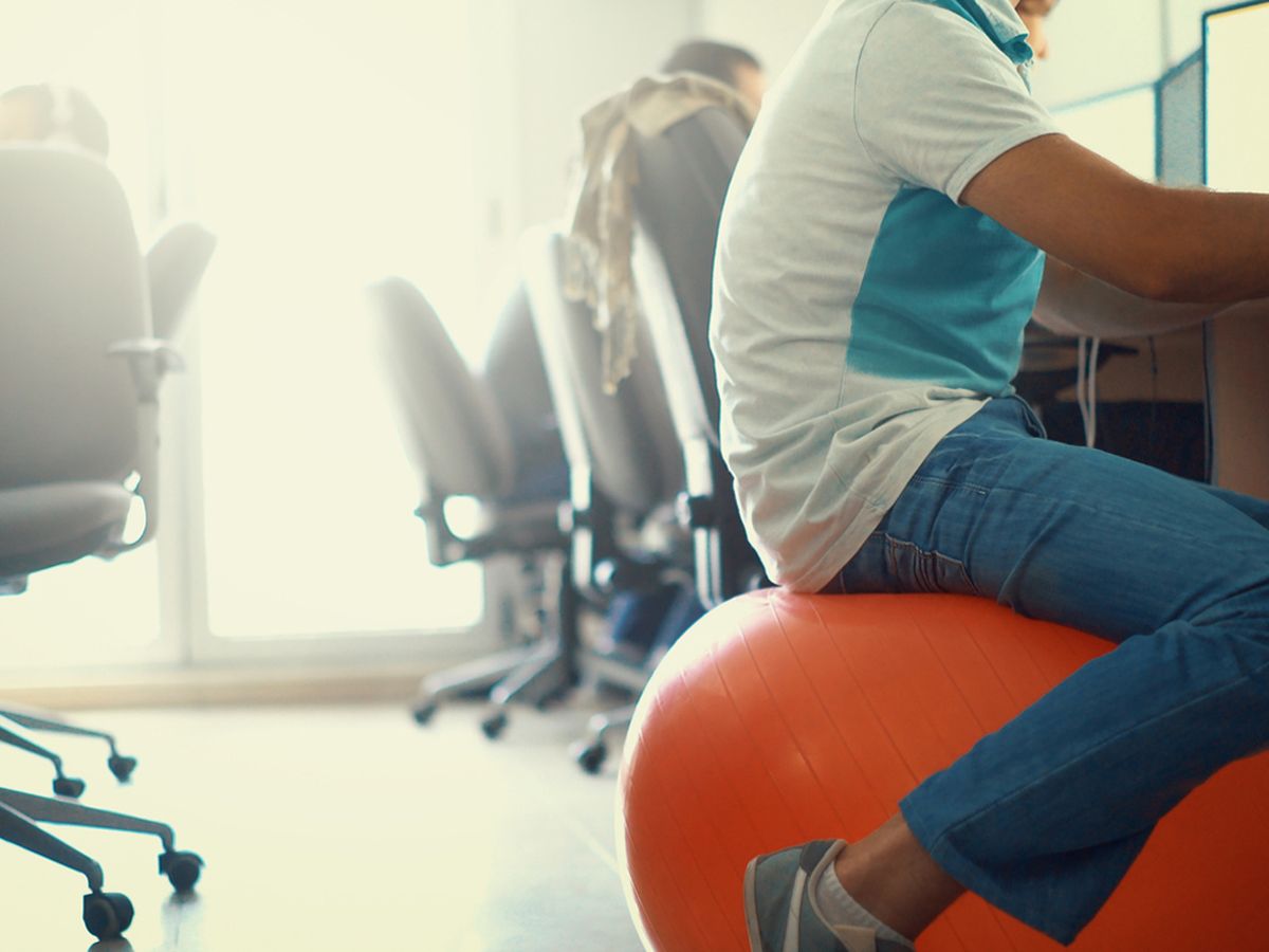 Thinking of sitting on an exercise ball at work? Here's why you